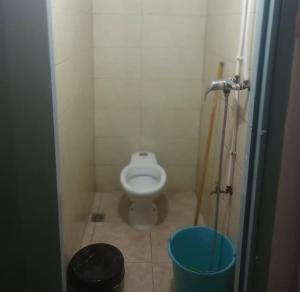 a small bathroom with a toilet in a stall at colomina SIDI IFNI in Sidi Ifni