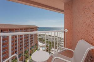 a balcony with a table and a view of the ocean at Perdido Beach Resort in Orange Beach
