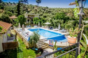 a villa with a swimming pool and a resort at Flower Hotel Patara in Patara