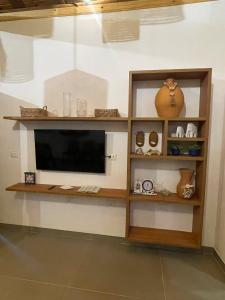 a television on a wall in a room at Sumar your beach house in Japaratinga in Japaratinga