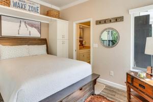 a bedroom with a bed and a window at Pool + Dock Access! Boater’s Base in Lake Placid in Lake Placid +25 photos