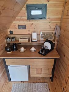 a small kitchen in a tiny house at Eagle's View Cabin in Plav +18 photos