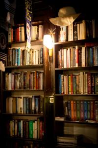 a book shelf filled with lots of books at Flower Hotel Patara in Patara