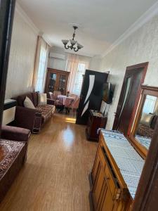a living room with a couch and a table at Cozy-home in Kobuleti