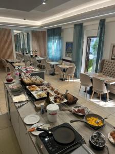 a buffet of food on a table in a room at Residence Abamar in Rimini