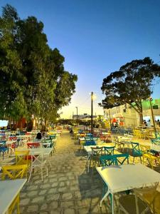 a group of tables and chairs on a street at The Village Resort By Acquaviva Gammarth in Gammarth