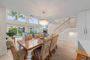 a dining room with a wooden table and chairs at Salt Life Sanctuary in Sanibel