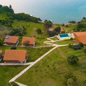 an aerial view of a house with a swimming pool at Umutuzo Lodge Kivu Lake in Buhoro