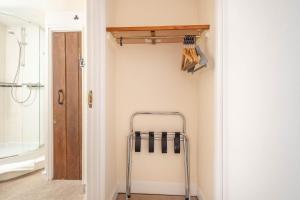 a bathroom with a walk in shower and a towel rack at Kings Arms Hotel in Cleobury Mortimer +27 photos