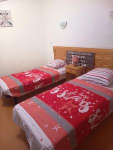 two beds sitting next to each other in a room at La Garrigue in Calvisson +25 photos