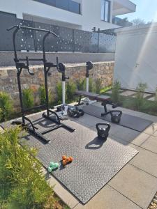a group of exercise equipment sitting on a patio at Marina Seaside Escape in Malinska