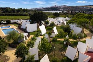 an aerial view of a village with white houses at Kampaoh Lago de Arcos in Arcos de la Frontera