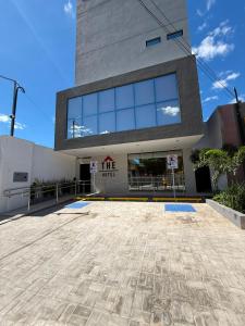 a building with a lot of windows on it at The Hotel in Teresina