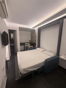 a bedroom with a large bed in a room at Alley House in Cefalù