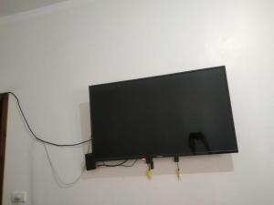 a flat screen tv hanging on a wall at The Blue House in Safaga