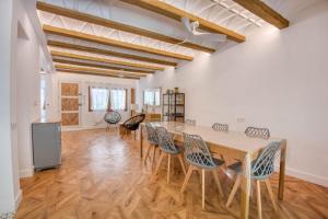 a large room with a wooden table and chairs at Pescadors in Pals
