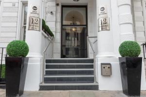 a front door of a white building with stairs at Best Western Mornington Hotel Hyde Park in London
