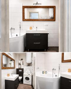 a bathroom with a sink and a tub and a toilet at Stylish air-conditioned Klaipeda Flat, Near Dane River in Klaipėda