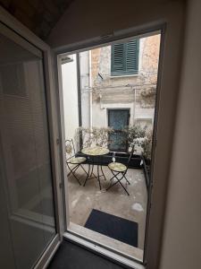 a view of a patio from a sliding glass door at Alley House in Cefalù