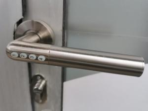 a metal door handle on a white door at PRISHTINA Stay in Prishtinë +6 photos