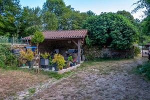 a small house with a garden in the yard at Lacour in Augignac