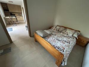 a bedroom with a bed in a small room at Prázdninový domeček in Heřmanice