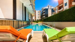 a swimming pool in the middle of a building at mood beach hotel in Didim