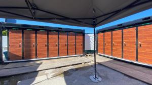 a room with wooden doors on a building at Munich Oktoberfest Village Breakfast included by Yes-Trips! in Munich +3 photos