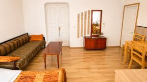 a living room with a couch and a table at Tuz House R3 in Bakuriani
