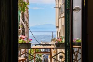 a view from the balcony of a building with flowers at Elia City House in Kavála