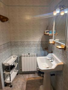 a bathroom with a sink and a mirror at Casa Rural Villacampa (Nocito) in Nocito +124 photos