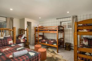 a room with two bunk beds and a couch at Ski Beaver Creek 4min Vail 10min in Avon