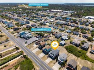 an overhead view of a city with a street sign at 5070 - Sandy Bottoms in Kill Devil Hills