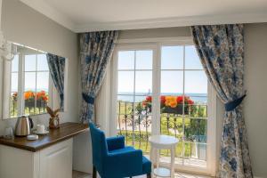 a room with a window with a view of the ocean at Sahil Panorama Otel in Trabzon