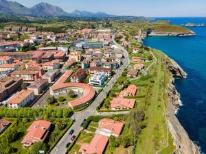 an aerial view of a town next to the ocean at Apartamentos San Pedro en Llanes in Llanes