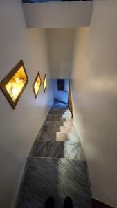 a long hallway with two mirrors on the wall at Bungalow in Tangier in Tangier