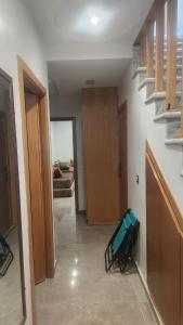 a room with a hallway with a couch and stairs at Bungalow in Tangier in Tangier