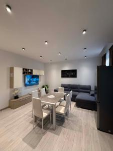 a living room with a table and a couch at B&B Legnago in Legnago