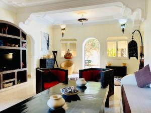 a living room with a couch and a table at Villa Azal in Mirleft