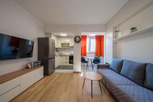 a living room with a couch and a table at Maremy in Zadar
