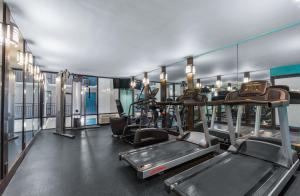 a gym with treadmills and ellipticals in a building at Captain's Quarters Resort in Myrtle Beach