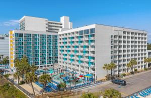 an aerial view of a hotel with a pool at Captain's Quarters Resort in Myrtle Beach
