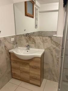 a bathroom with a sink and a shower at Casa dolce casa in Gorfigliano +13 photos