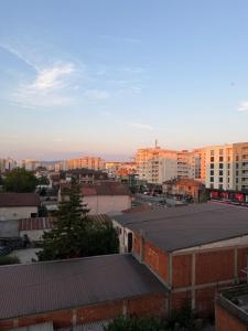 a view of a city with buildings in the background at Ring Urban Apartment in Kosovo Polje