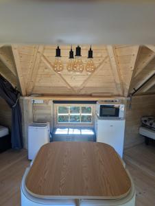 a dining room with a table in a tiny house at Camping de Graçay in Graçay