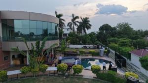 an overhead view of a building with a swimming pool at Savanna Farm in Nagpur