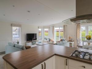 a kitchen and living room with a counter top at Hazelwood 3 in Lyme Regis