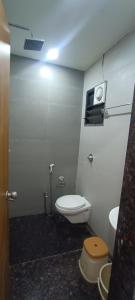 a bathroom with a toilet and a sink at Savanna Farm in Nagpur +30 photos