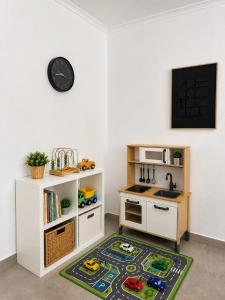 a kitchen with a sink and a kitchen rug at The Nook, Lourinha in Lourinhã +5 photos