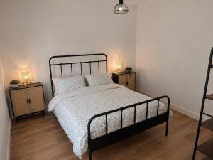 a bedroom with a bed and two night stands at The Nook, Lourinha in Lourinhã